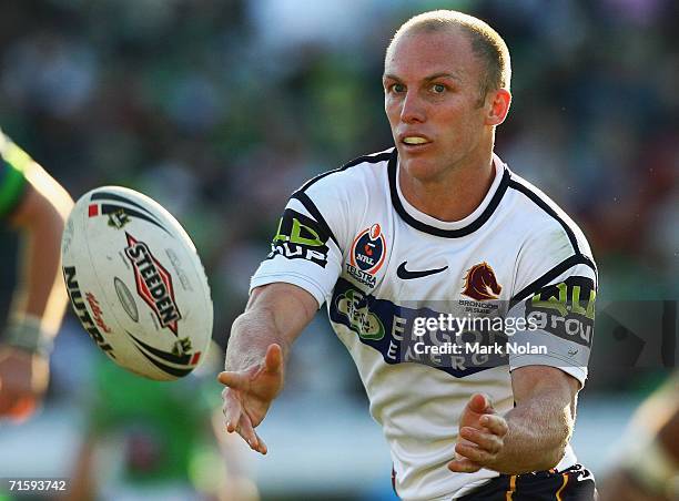 Darren Lockyer of the Broncos passes during the round 22 NRL match between the Canberra Raiders and the Brisbane Broncos played at Canberra Stadium...