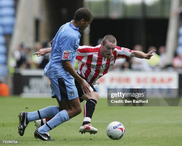 Marcus Hall of Coventry City and Stephen Elliott of Sunderland in action during the Coca-Cola Football League Championship game between Coventry City...
