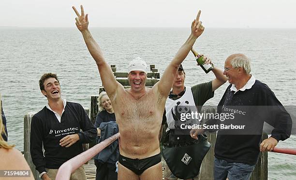 Environmental campaigner Lewis Gordon Pugh celebrates as he arrives at Southend Pier on August 6, 2006 at Southend-on-Sea, England. Pugh has become...