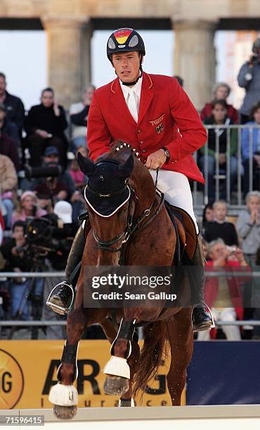 German national equestrian team member Christian Ahlmann performs in front of the Brandenburg Gate at a promotional event for the World Equestrian...