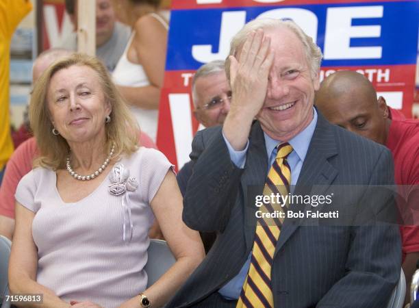 Senator Joe Lieberman laughs as his wife Hadassah Lieberman looks on while campaigning with former Senator Max Cleland August 6, 2006 at the East...