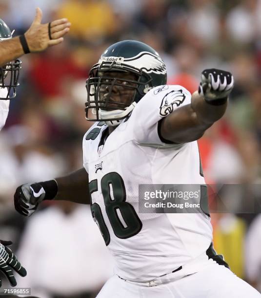 Linebacker Trent Cole of the Philadelphia Eagles celebrates after sacking quarterback Aaron Brooks of the Oakland Raiders in the AFC-NFC Pro Football...