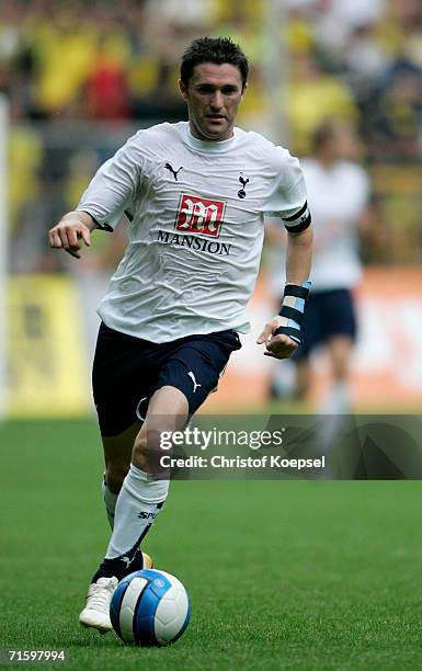 Robbie Keane of Tottenham runs with the ball during the friendly match between Borussia Dortmund and Tottenham Hotspur at the Signal Iduna Park on...