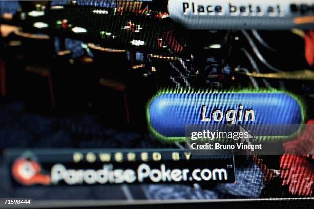 In this photo illustration the cursor hovers over the "login" button on a screen on an online gambling website on August 7, 2006 in London. Online...