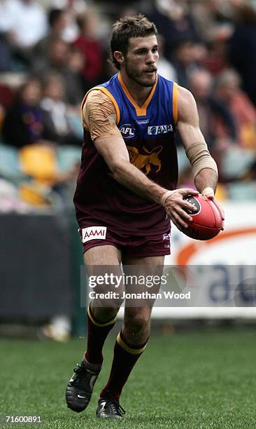 Robert Copeland of the Lions looks to pass during the round 18 AFL match between the Brisbane Lions and the Geelong Cats at the Gabba on August 6,...