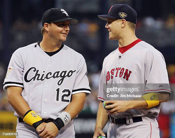 American League All-Star pitcher Jonathan Papelbon of the Boston Red Sox talks with catcher A.J. Pierzynski of the Chicago White Sox before playing...