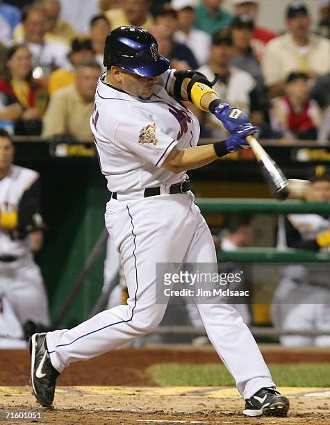 National League All-Star Catcher Paul Lo Duca of the New York Mets swings at a pitch against the American League All-Stars during the 77th MLB...