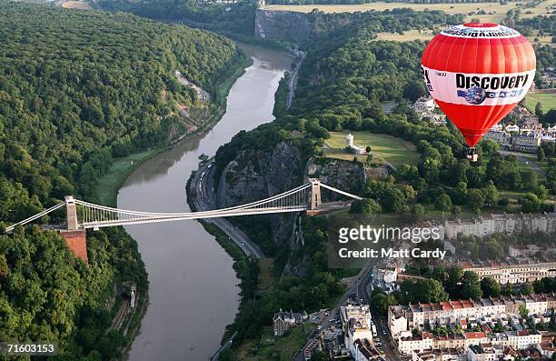 Hot air balloon flies past Isambard Kingdom Brunel's Clifton Suspension Bridge above Bristol city centre on August 8, 2006 in Bristol, England. The...