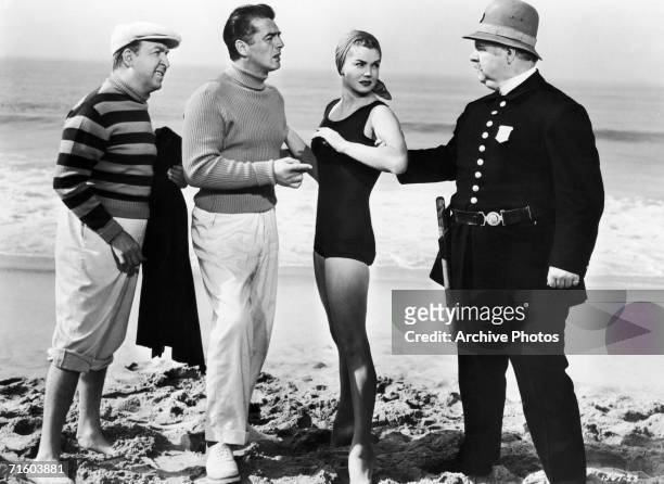 From left to right, American actors Jesse White , Victor Mature , Esther Williams and Charles Watts star in the MGM film 'Million Dollar Mermaid', a...