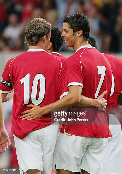Cristiano Ronaldo of Manchester United celebrates with team mate Ole Gunnar Solskjaer after scoring the second goal during the pre-season friendly...