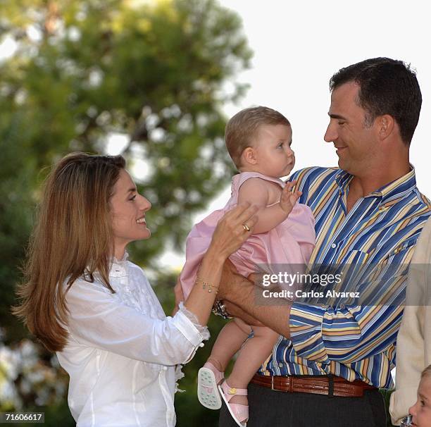 Crown Prince Felipe of Spain, his wife Princess Letizia and his daughter Princess Leonor attend a photocall during their summer holidays at Marivent...