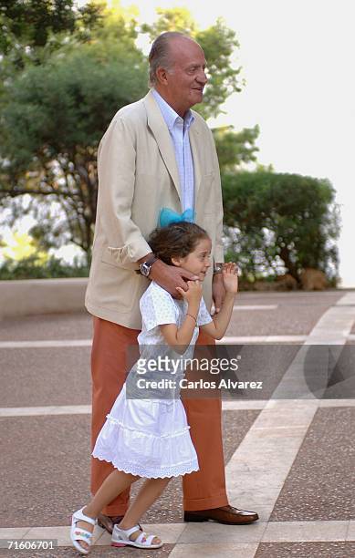 King Juan Carlos of Spain and his grandaughter Victoria Federica attend a photocall during their summer holiday at Marivent Palace on August 08, 2006...