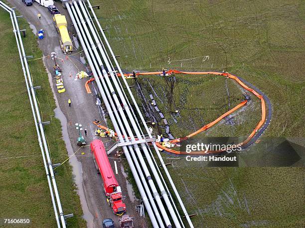 In this photo provided by BP, workers attempt to repair an oil leak at BP's Prudoe Bay oil field facility in August 7, 2006 in Prudoe Bay, Alaska. BP...