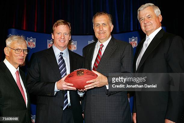 Dan Rooney, owner of the Pittsburgh Steelers, new commissioner Roger Goodell, outgoing NFL commissioner Paul Tagliabue and Jerry Richardson, owner of...