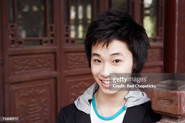 portrait of a teenage boy smiling - chinese collar stockfoto's en -beelden