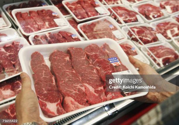 Customer looks at a U.S. Beef product at a branch of U.S. Owned supermarket Costco on August 9, 2006 in Chiba, Japan. The Japanese government lifted...