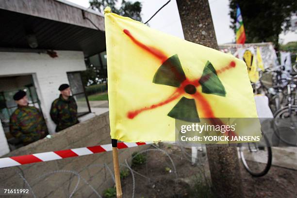 Soldiers stand guard 09 August 2006 during a demonstration of around 150 activists of Mother Heart that blocked the entrance of Kleine-Brogel nuclear...