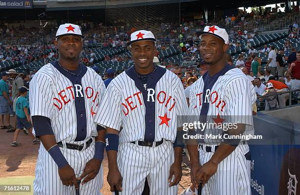 Marcus Thames, Curtis Granderson and Craig Monroe of the Detroit Tigers show off their Detroit Stars Negro League uniforms prior to the game against...