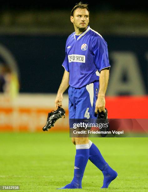 Jens Nowotny of Dinamo Zagreb looks dejected after the UEFA Champions League Qualification third round match between Dinamo Zagreb and Arsenal at the...