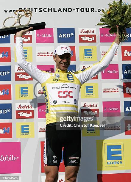 Jens Voigt of Germany and CSC celebrates on the podium with the trophy after winning the Deutschland Tour after the final stage August 9, 2006 from...