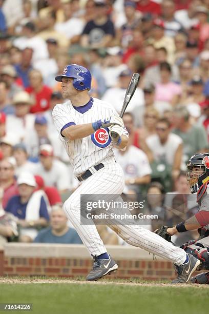 Michael Barrett of the Chicago Cubs bats during the game against the St. Louis Cardinals at Wrigley Field in Chicago, Illinois on July 29, 2006. The...