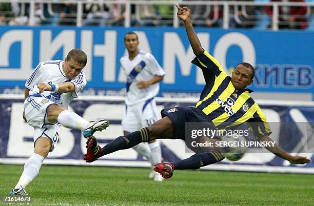 Sergiy Rebrov of Dynamo Kiev goes for a shot past Fenerbahce's Marko Aurelio during a Champions League qualifying round first leg match in Kiev, 09...