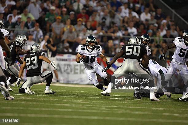 Safety J.R. Reed of the Philadelphia Eagles returns with the ball on August 6, 2006 in the AFC-NFC Pro Football Hall of Fame Game at Fawcett Stadium...