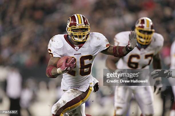Running back Clinton Portis of the Washington Redskins runs with the ball during the game against the Philadelphia Eagles on January 1, 2006 at...