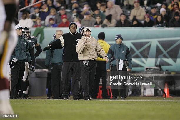 Secondary/safeties coach Sean McDermott of the Philadelphia Eagles signals to the secondary during the game against the Washington Redskins on...