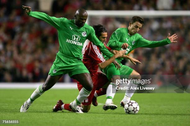 Luis Garcia of Liverpool is sandwiched by Xavir Dirceo and Gustavo Boccoli of Maccabi Haifa during the UEFA Champions League third qualifying round...