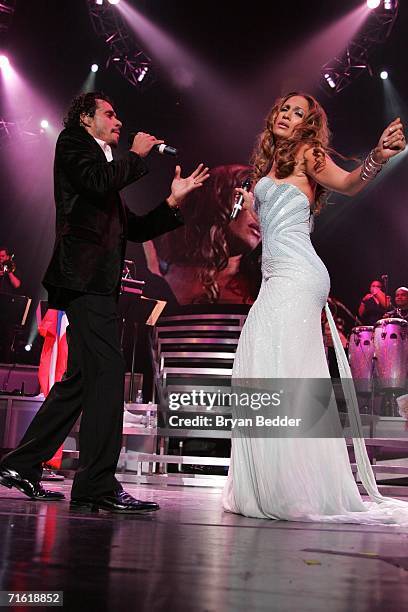 Musicians Marc Anthony and Jennifer Lopez perform live on stage during the Juntos Tour concert at Madison Square Garden on August 9, 2006 in New York...