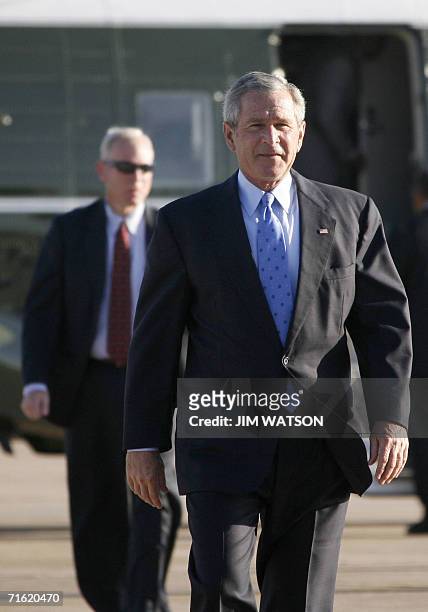 Crawford, UNITED STATES: US President George W. Bush walks to Air Force One at Texas State Technical College in Waco, Texas, 10 August 2006 as he...