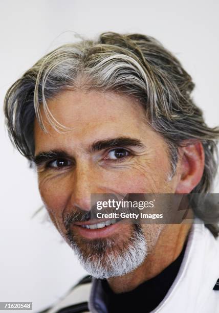 Damon Hill looks on in the garage during testing for the GP Masters of Great Britain at Silverstone Circuit on August 10 in Silverstone, England.