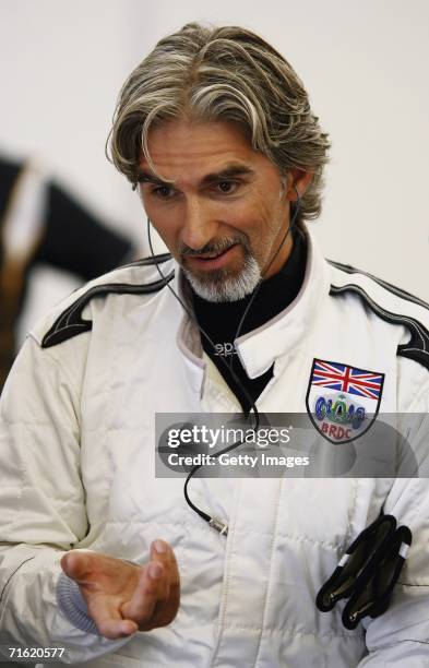 Damon Hill looks on in the garage during testing for the GP Masters of Great Britain at Silverstone Circuit on August 10 in Silverstone, England.