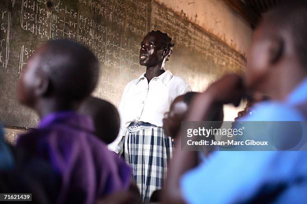 Jane Adong teaches a class on June 22, 2006 in Patongo IDP camp in Pader District, Uganda. She works as a teacher and loves to give music lessons to...