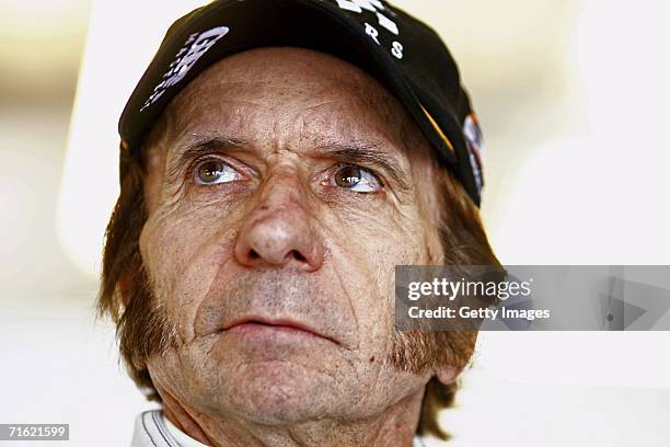 Emerson Fittipaldi waits in the pits during testing for the GP Masters of Great Britain at Silverstone circuit on August 10 in Silverstone, England.