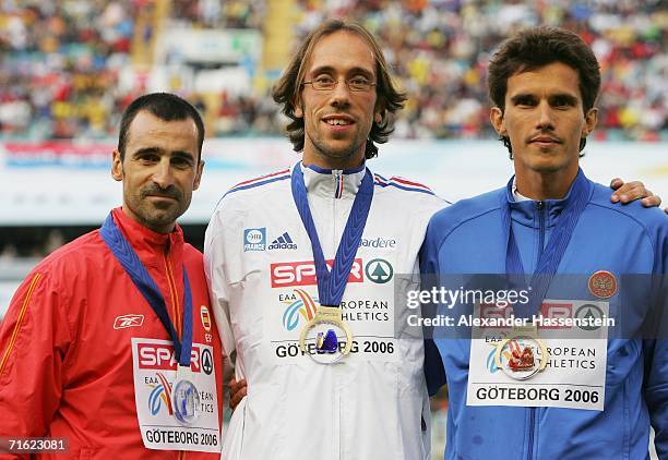 Gold medallsit Yohan Diniz of France poses with silver medallist Jesus Angel Garcia of Spain and bronze medallist Yuriy Andronov of Russia during the...