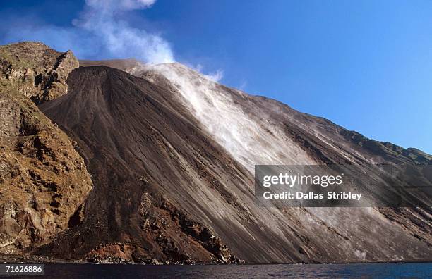 lava covered sciarra del fuoco steams with fresh lava flow, italy - fuoco stock pictures, royalty-free photos & images
