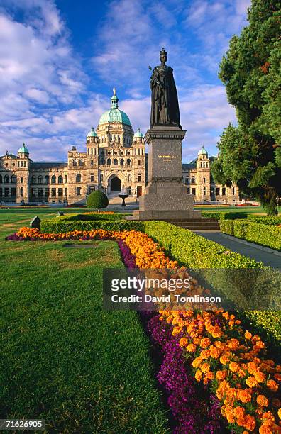 gardens and statue in front of parliament buildings, victoria, canada - victoria canada stock pictures, royalty-free photos & images
