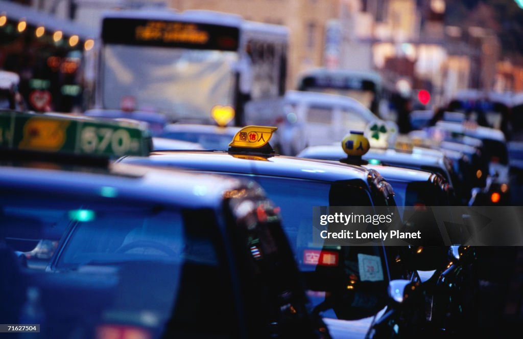 Taxis in main shopping street, Kyoto, Japan