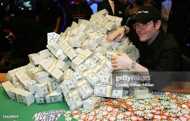 Jamie Gold of California poses with the USD 12 million he won in the World Series of Poker no-limit Texas Hold 'em main event at the Rio Hotel &...