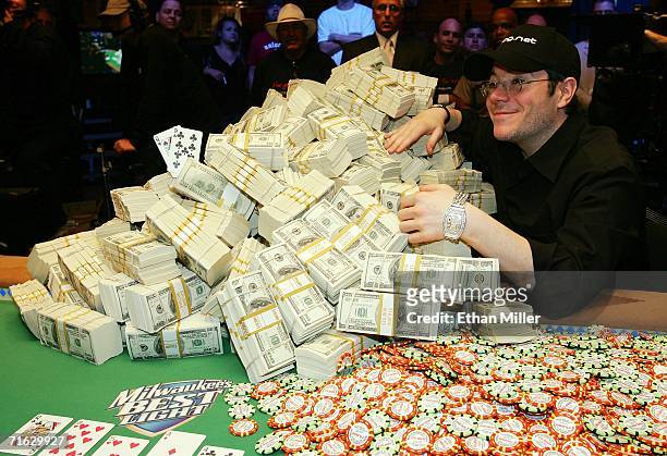 Jamie Gold of California poses with the USD 12 million he won in the World Series of Poker no-limit Texas Hold 'em main event at the Rio Hotel &...