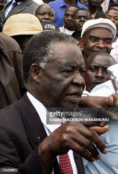 Zambian presidential candidate from the Patriotic Front, Michael Sata, leaves 11 August 2006, the Supreme Court grounds in Lusaka after filing in his...