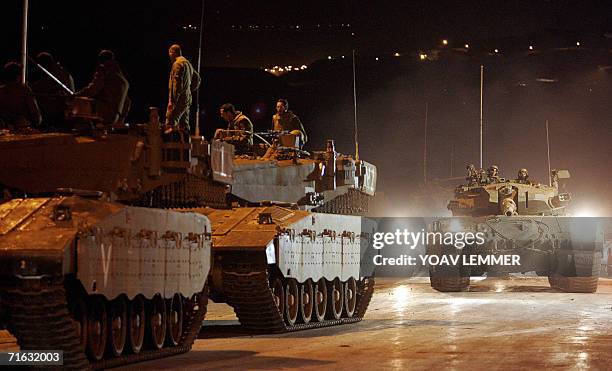 Israel-Lebanon Border, ISRAEL: Israeli tanks form a queue along the Lebanon-Israel border as they prepare for a possible incursion into Lebanon as...