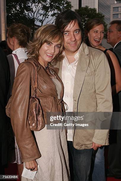 Actress Gesine Cukrowski and Michael Helfrich attend the premiere of the play "Die Dreigroschenoper" at the Admiralspalast on August 11, 2006 in...