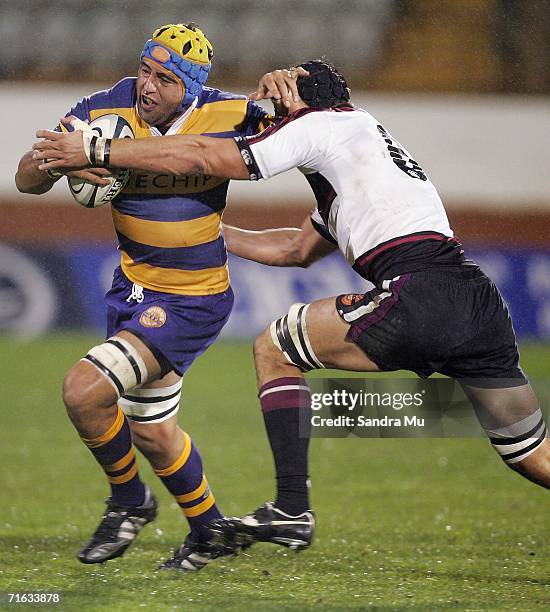 Warren Smith of Bay of Plenty fends Anthony Boric of North Harbour during the Air New Zealand Cup match between the Bay of Plenty and North Harbour...