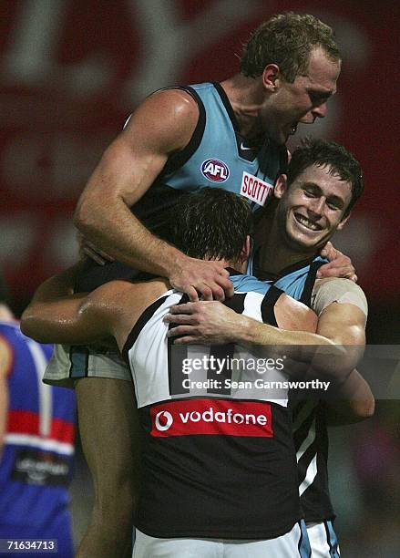 Chad Cornes and Michael Pettigrew for the Power celebrate a goal during the round 19 AFL match between the Western Bulldogs and the Port Adelaide...