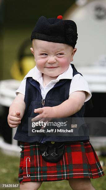 Month old Jamie Livingston from Northen Ireland smiles during the World Pipe Band Championships at Glasgow Green on August 12, 2006 in Glasgow,...