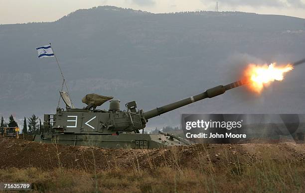 An Israeli artillery piece fires towards southern Lebanon August 12, 2006 on the Israel-Lebanon border. Israel continues to expand its ground...