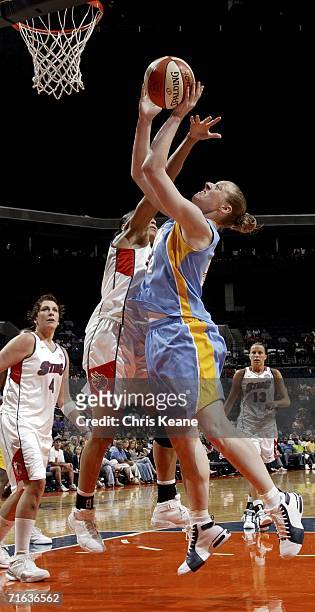 Liz Shimek of the Chicago Sky works to shoots the ball over Allison Feaster of the Charlotte Sting on August 12, 2006 at the Charlotte Bobcats Arena...